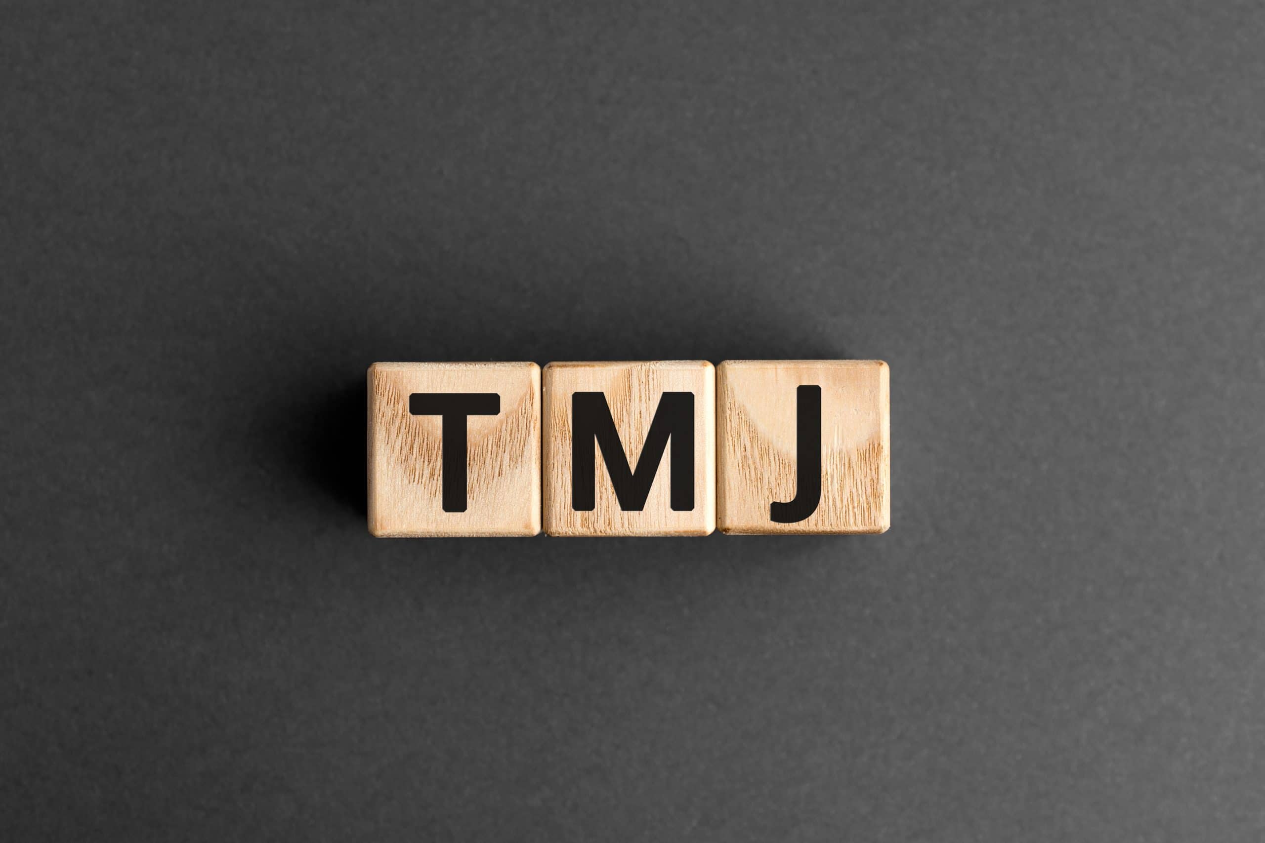 TMJ – acronym from wooden blocks with letters, abbreviation TMJ ...